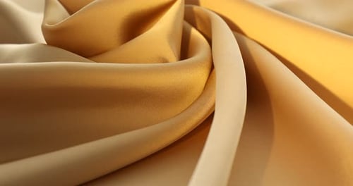 Golden Fabric Swirls in Gentle Light