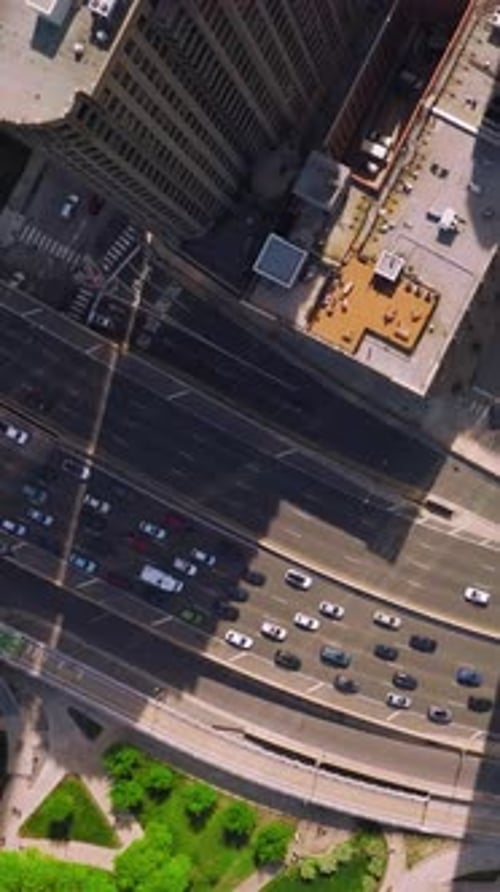 Speed highway with numerous automobiles going along. Busy traffic among the skyscrapers of Chicago