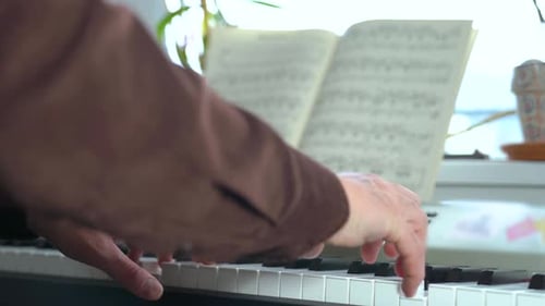 Close up of Hands Playing Piano