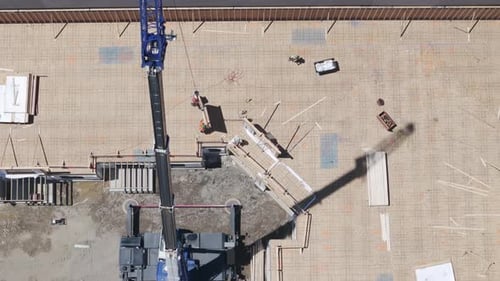 Construction Worker Doing Construction Work on Large Construction Site Drone Top Down View
