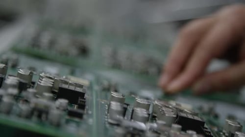 Electronics manufacturing - Stuffing a circuit board in electronics factory