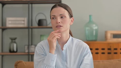 Brainstorming Young Woman Thinking while at Home