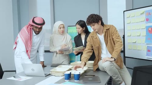 Diverse Colleagues Brainstorming in Modern Office Workspace
