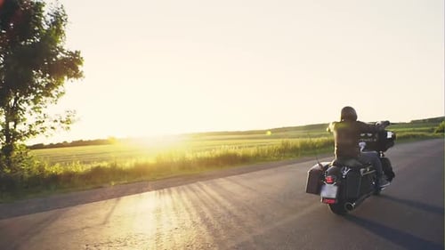 Man Driving Road in Sunset