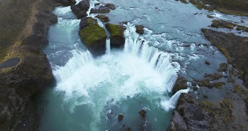 Aerial View of Majestic Waterfall and River