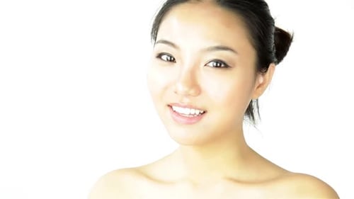 Attractive woman from east asia in her 20s isolated in studio