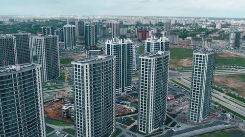 Aerial View of a Row of Highrise New Buildings in a New Residential Area Against the Background of