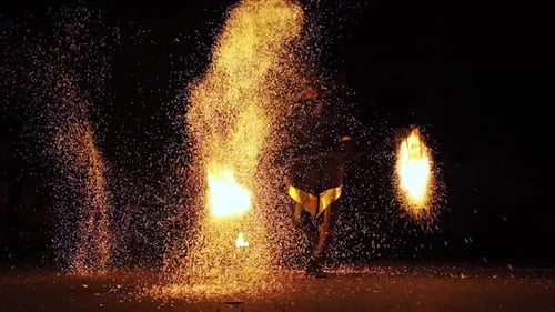 Fire Dancer Performance at Night in Urban Setting