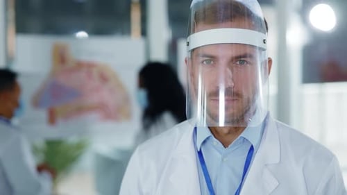 Doctor Wearing Face Shield in Modern Hospital Setting