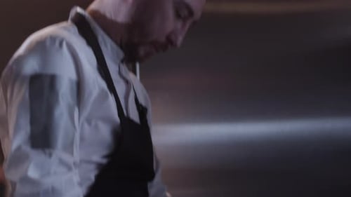 Chef Chopping Onions in a Commercial Kitchen