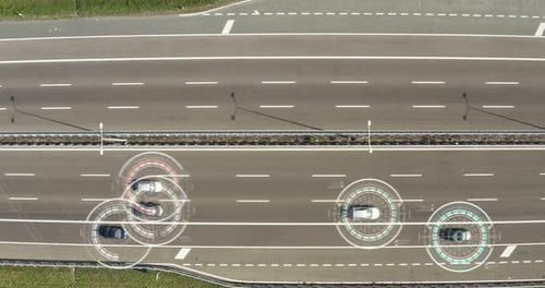 Aerial view of a highway where cars pass to go to the city and a futuristic graphic appears. Conce