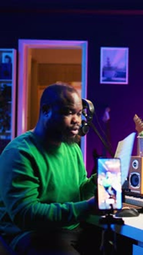 Person Holding Sheet Music in Music Studio