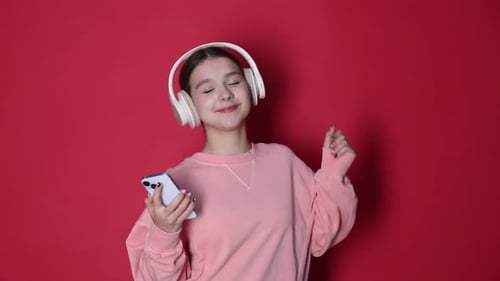 Teen Girl Listening to Music and Dancing