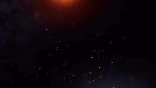 Cinematic fiery sparks and glowing embers dark background