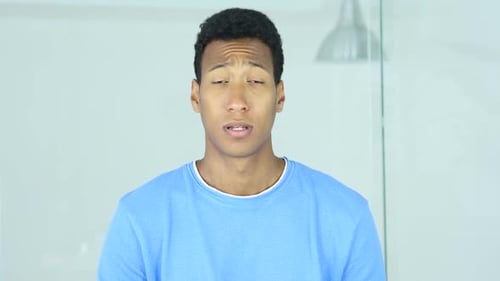 Okay Sign By Excited AfroAmerican Man in Office