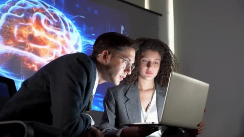 Professionals discuss new brain research findings in a modern office setting with a presentation in