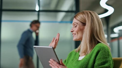 Excited Entrepreneur Greeting Businessman at Office Hall Closeup. Smiling Businesswoman Talking Tabl