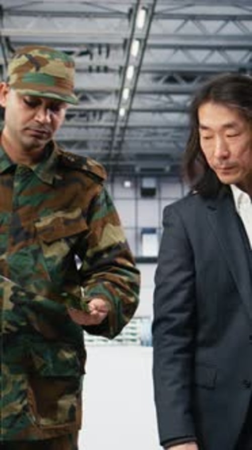 Vertical Video Soldier Talks with Microchip Plant Manager National Security Concept