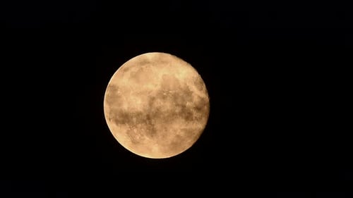 Stunning Full Moon Rise Through Dynamic Clouds on a Dark Night Sky