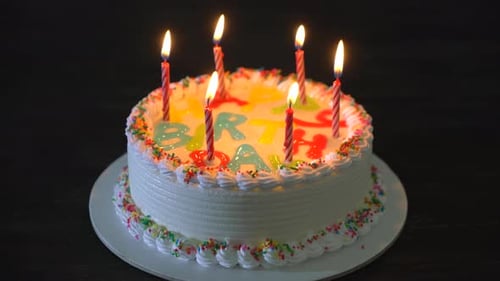 Delicious Birthday Cake with Lit Candles Close-Up