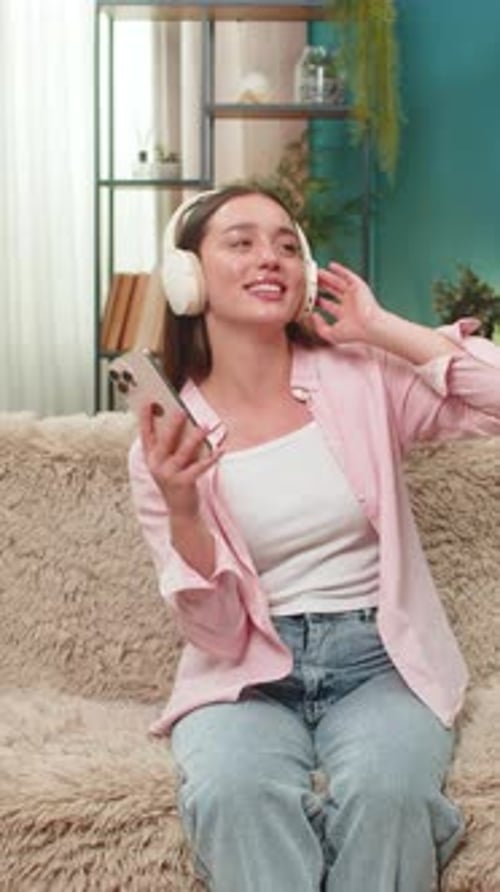 Woman Listening to Music, Dancing, and Video Conferencing