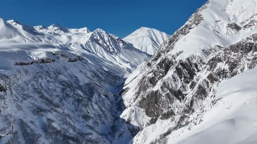 Aerial view of beautiful snowy mountains in Gudauri, Georgia
