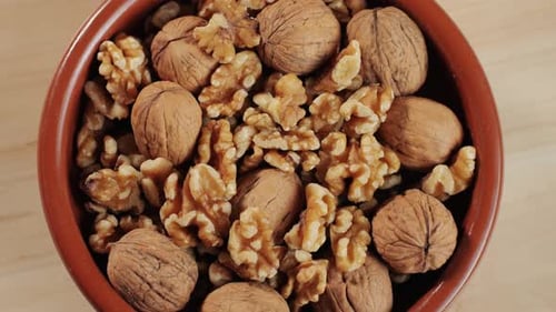Mix of Walnuts in Red Plate Top View Walnut in Shell Walnut Without Shell Peeled Nuts Healthy Snacks
