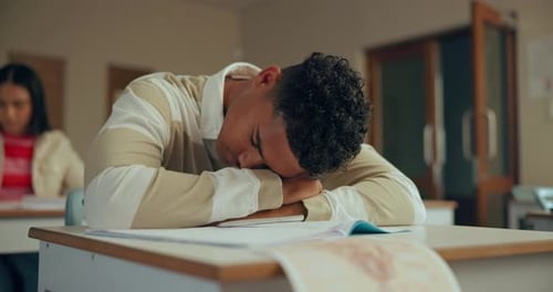 High school, burnout or tired boy sleeping n classroom with fatigue, risk