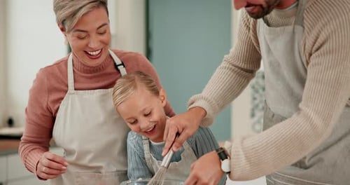 Family Baking Cake in Kitchen Together