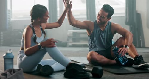 Coach, high five or happy woman at gym on a break in boxing exercise or workout for fitness support