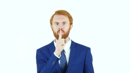 Gesture of Silence By Red Hair Beard Businessman Finger on Lips