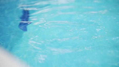 The ripples of water on the surface of a pool. Super slow motion.