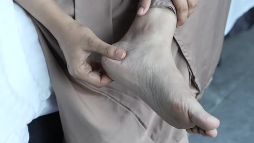 Close Up on Women Feet and Hand Massage on Injury Spot