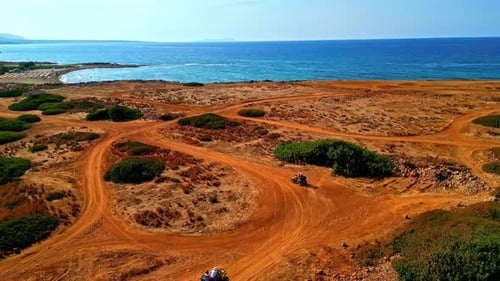 Tourists Driving All-terrain Vehicle, ATV To The Potamos Beach In Vrachasi, Greece. - aerial shot