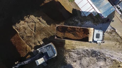 Aerial Video of Heavy Machinery Working on Building Foundation