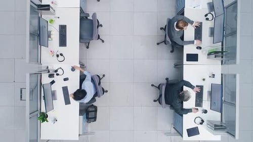 Aerial Top Down Drone Shot of Big Busy Corporate Office with Tow Rows off Businessmen and Businessw