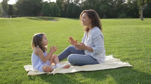 Mother and Daughter Enjoying Time in Summer Park