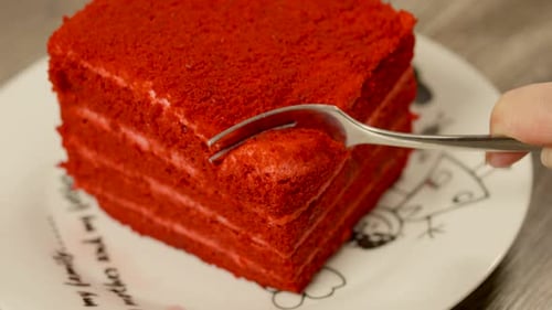 Fork Takes Piece of Red Velvet Cake