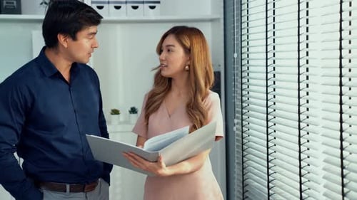 Business Colleagues Discussing Work in Modern Office