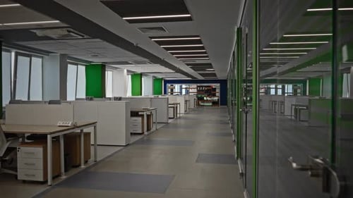 Modern Openplan Office Interior with White Workstations Ergonomic Chairs and Bright Accent Walls in
