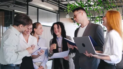 Energetic Business Team Collaborating in Modern Office