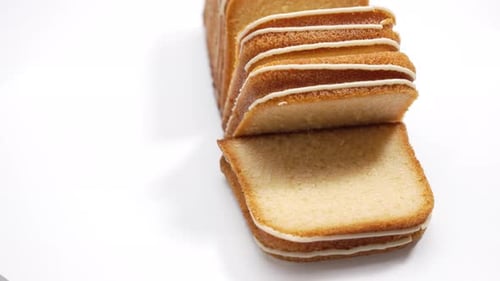 Tasty lemon loaf cake on a white background