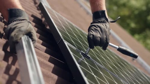 Close up of PV professional installing new high-end black Solar Panel, day