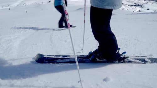 Skier and snowboarder kids take off downhill alpine piste on Mount Ruapehu