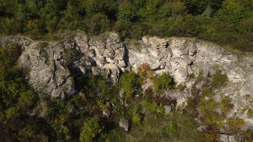Aerial View on Rocky Hill Drone Backwards Reveal Over Abandoned Stone Quarry