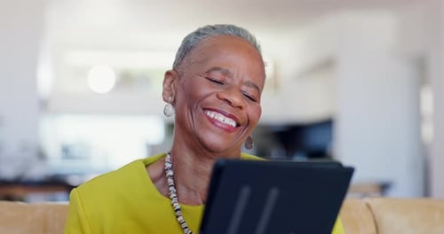 Senior woman, tablet and laugh in home for reading news app, ebook or social network in lounge