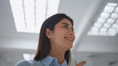 Smiling Girl Drinking Water in Office Closeup Happy Businesswoman Taking Sip
