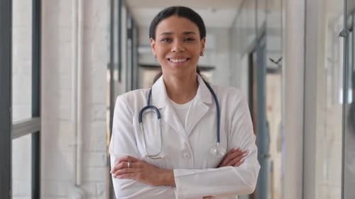 Confident Doctor with Stethoscope in Hospital Setting