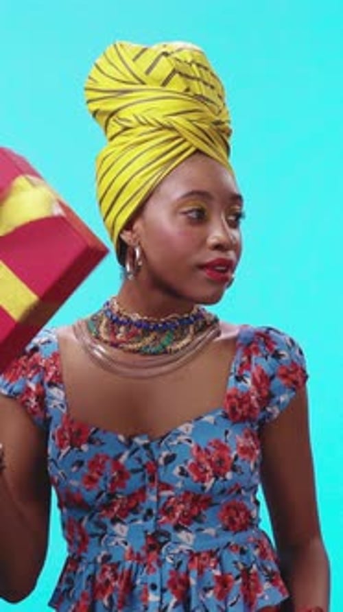 Woman Smiles Holding Birthday Gift