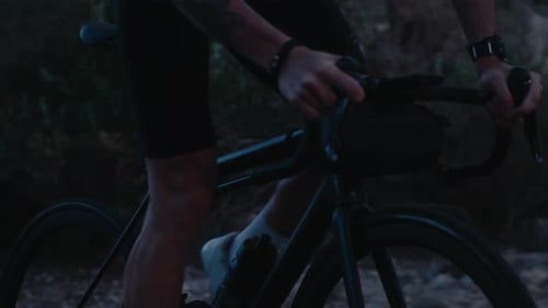 Professional Road Cyclist Ride Carbon Bike in Dusk